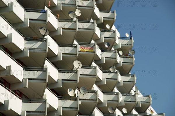 High-rise apartment building with balconies and satellite dishes, satellite town of Chorweiler in