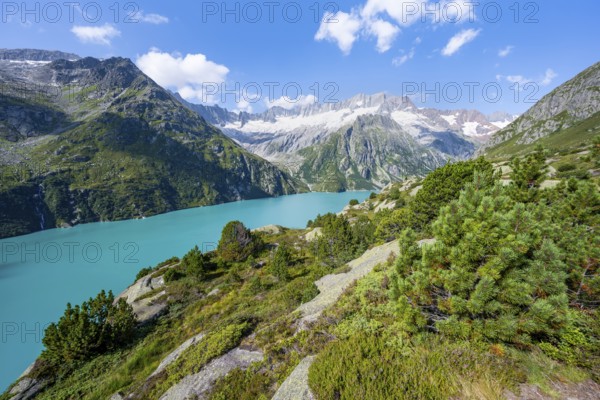 Turquoise blue mountain lake Göscheneralpsee, picturesque mountain landscape with dammastock and