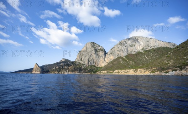 Picturesque rocky coast, cliffs with Pedra Longa pinnacle, blue sea, Golfo di Orosei, Baunei,