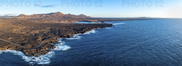 Coast with lava fields, volcanic landscape near Los Hervideros, in the evening light, aerial view,