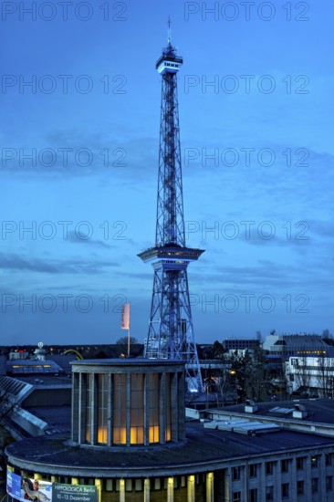 Blue-lit Berlin radio tower, steel half-timbered building by architect Heinrich Straumer, Langer