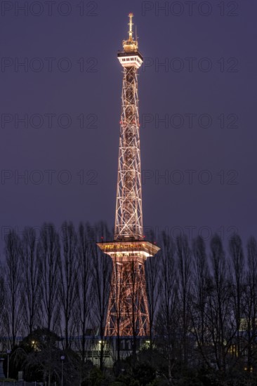 Red illuminated Berlin radio tower, half-timbered steel building by architect Heinrich Straumer,