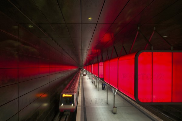 HafenCity University subway station, illuminated in color, red, underground train, movement effect,