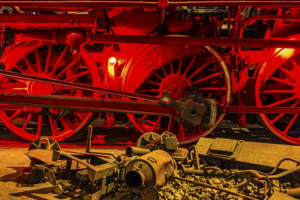 Illuminated wheelwork of a historic locomotive, railway museum, Augsburg railway park,