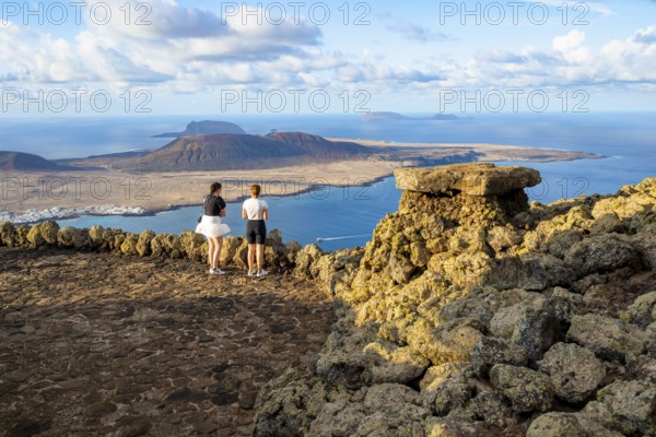 Tourists on the viewing platform at the Mirador del Río viewpoint, in the evening light, view of
