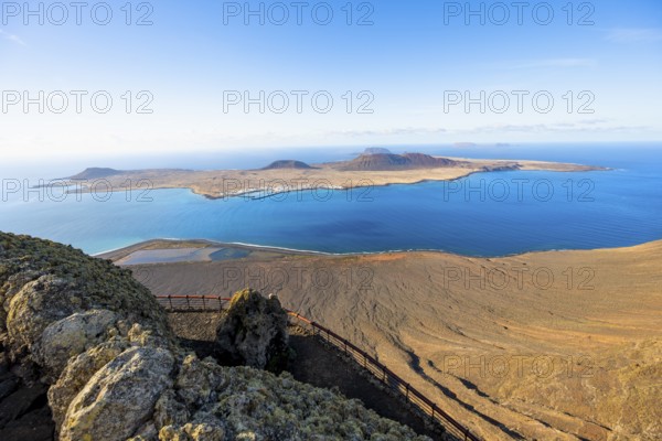 View of La Graciosa island with volcanic craters in the evening light, Mirador del Río viewpoint