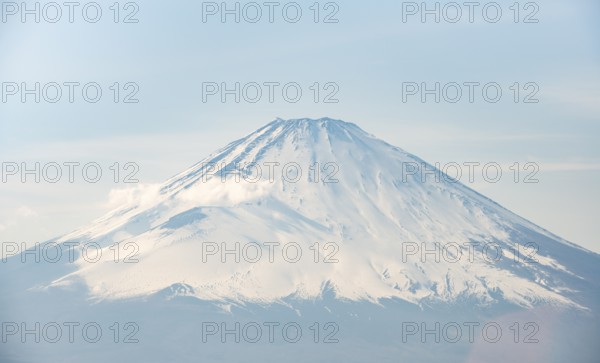 Snow-covered summit of Mount Fuji volcano in spring, Owakudani, Hakone, Japan