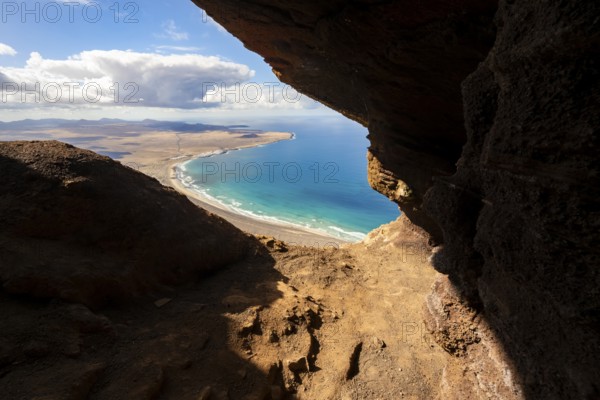 Cueva de las Cabras cave, view from the Risco de Famara cliffs on Famara beach, Playa de Famara