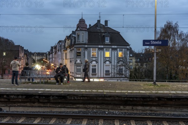 Essen-Steele S-Bahn station, passengers waiting for the train late afternoon, in autumn, Essen,