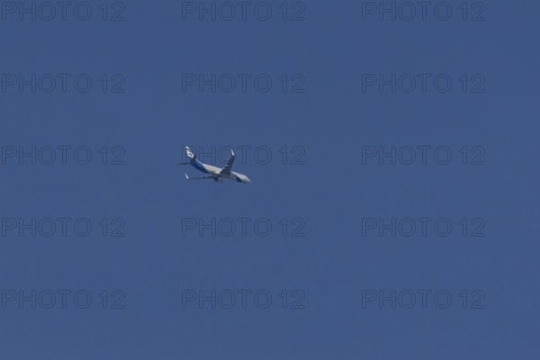 Boeing 737 jet passenger aircraft of El Al Israel airlines flying in a blue sky, England, United