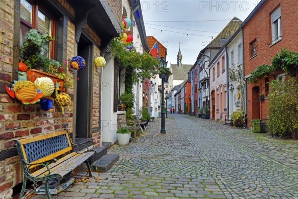 Tiefstraße decorated for Martin's procession with the tower of St. Peter's Church, Kempen, Lower