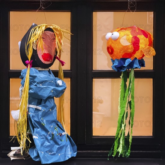 Homemade lanterns for the Martin procession in front of a window in the evening, Old Town, Kempen,