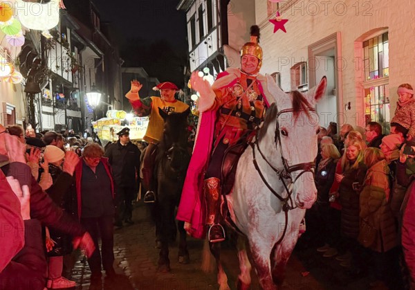 St. Martin on a white horse train in Alte Schulstraße in the evening, Altstadt, Kempen, Lower