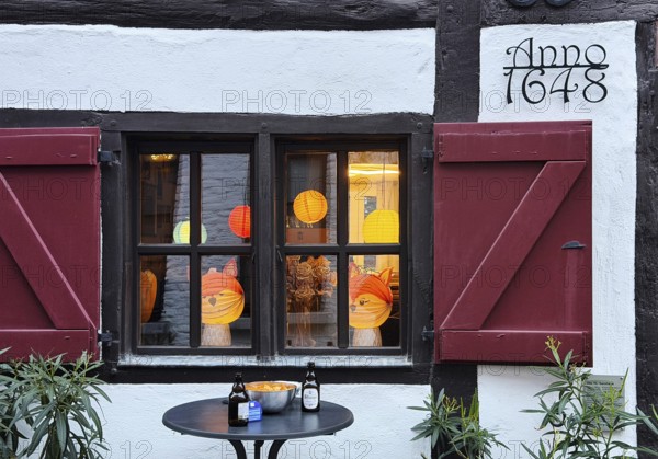 Half-timbered house in the Tiefstraße decorated for the Martin train, Altstadt, Kempen, Lower