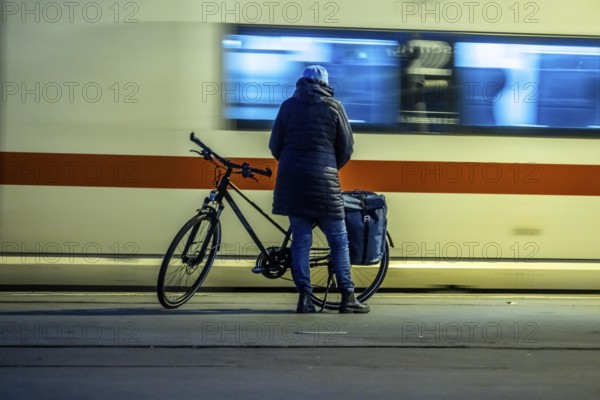 Cyclists waiting for the train, in Essen main station, on the platform, North Rhine-Westphalia,