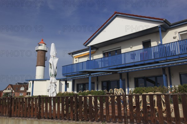 Timmendorf lighthouse on the island of Poel on the Baltic Sea, building in the foreground,
