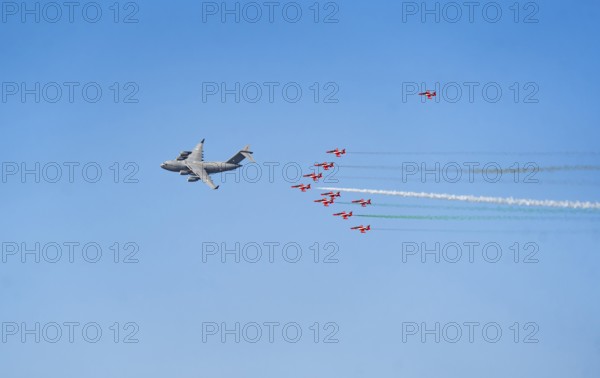 The Indian Air Force aerobatic team performs during an air show as part of the 93rd Air Force Day