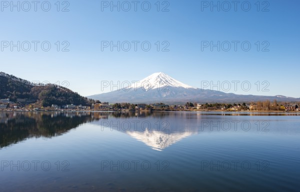 Volcano Mt. Fuji is reflected in Lake Kawaguchi, Yamanashi Prefecture, Japan