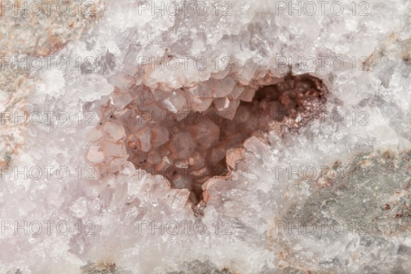 A sparkling quartz geode reveals sparkling crystals inside. The light plays with the facets of
