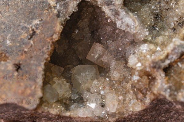Glowing crystals are visible inside the rough stone and reveal a beautiful geological spectacle.