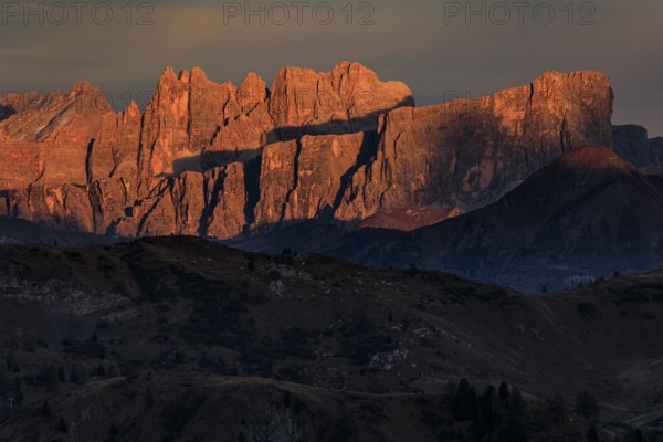 Steep mountains, mountain range, sunset, cloudy, autumn, Pordoi Pass, view of Croda da Lago,