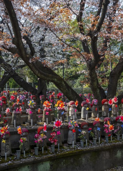 Jizo statues with red crocheted caps, guardian deities for deceased children, Unborn Children
