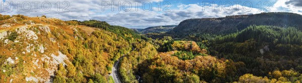 Autumn colours over Gwydir Forest Park from a drone, Afon Lledr, Road A470, Snowdonia, Eryri,