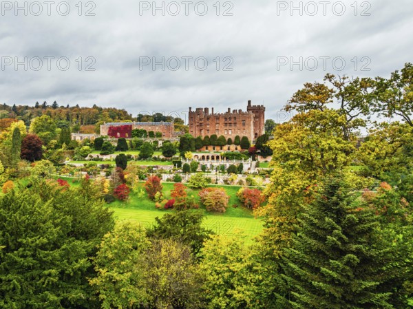 Autumn colours over Powis Castle and Garden from drone, Welshpool, Powys, Wales, England, United