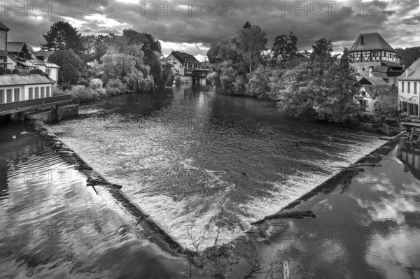 View of the Pegnitz with the river weir, on the right the historic Jewish Tower, black and white,