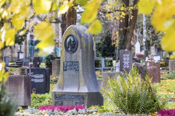 Honorary grave of poet Eduard Mörike. Pragfriedhof Stuttgart in autumn. November is traditionally a