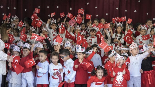 Children celebrate the 102nd anniversary of the Republic Day of Turkey, a national holiday