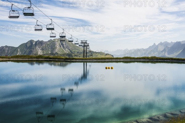 Mountain landscape with reservoir and chairlift, Saloberkopf, Warth, Bregenzerwald, Vorarlberg,
