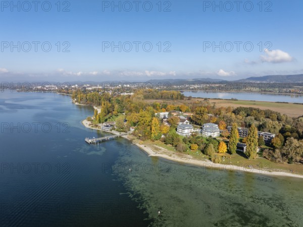 Aerial view of the Mettnau peninsula, surrounded by autumn vegetation, in western Lake Constance