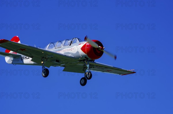 A Jakovlev Jak-52 with registration LY-HLZ during a flight demonstration as part of an air show on