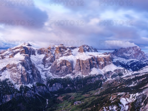 Sella group with fresh snow above the green Val Badia valley, Langkofel on the right, Dolomites,