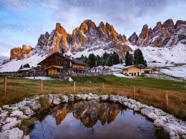Geisleralm with Geisler Group in Alpenglühen, reflection, Dolomites, Santa Magdalena, Trentino,