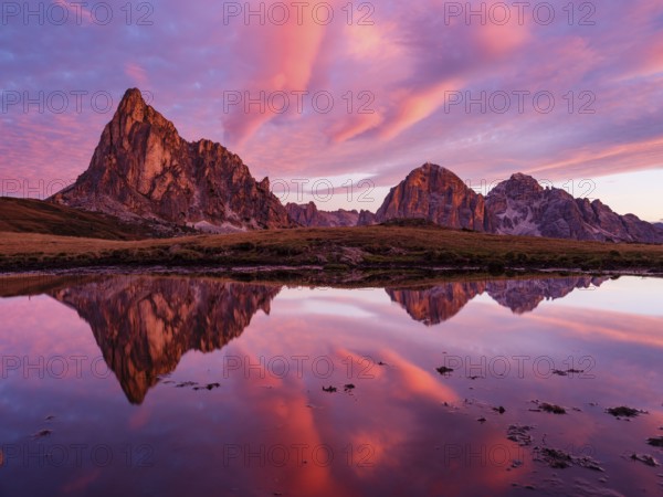 Alpine glow, reflection of the Ra Gusela and Tofane mountains at dawn, Passo di Giau, Giau Pass,