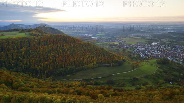 Indian summer at sunset on Albtrauf with a view of the Hohenneuffen castle ruins
