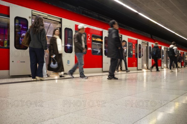 Underground arriving S-Bahn, train, class 420 in traffic red, platform, stop, Stadtmitte station,