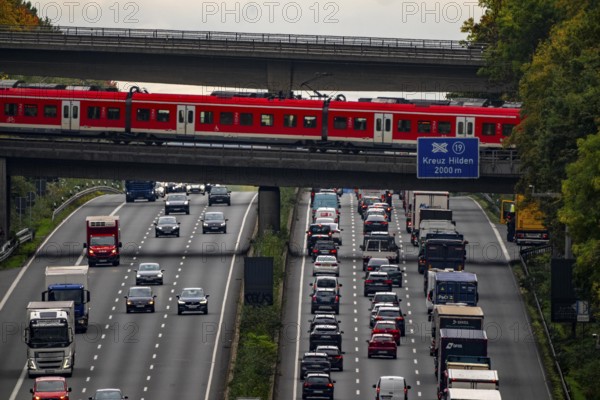 Local train crossing the A3 motorway between the Hilden junction and the Mettmann junction, view to