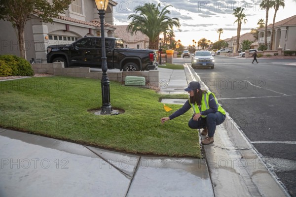 Las Vegas, Nevada - Devyn Choltko, a water waste investigator, patrols a residential neighborhood