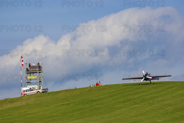 A Jakovlev Jak-55 with the registration LY-AGL during a flight demonstration as part of an air show