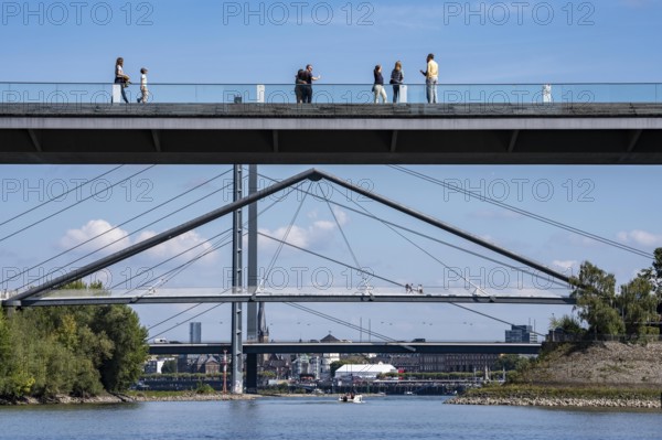 Bridges in Düsseldorf, in the foreground, the pedestrian and cycle bridge over the canal to the