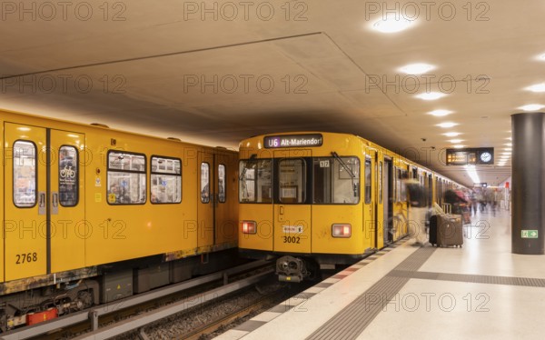 Dynamic scene of a Berlin underground in typical yellow colour, long exposure with blur effect,