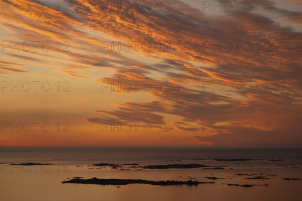 Offshore islands and skerries, sea, dramatically illuminated clouds, sunset, Otroya or Otrøya