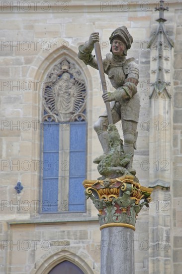 Sculpture of St George with stabbing weapon fighting dragons at St George's Fountain, detail,