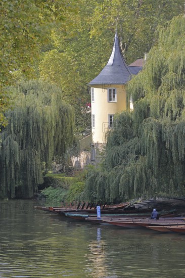 Hölderlin Tower on the banks of the Neckar with punting boats, memorial to Friedrich Hölderlin,