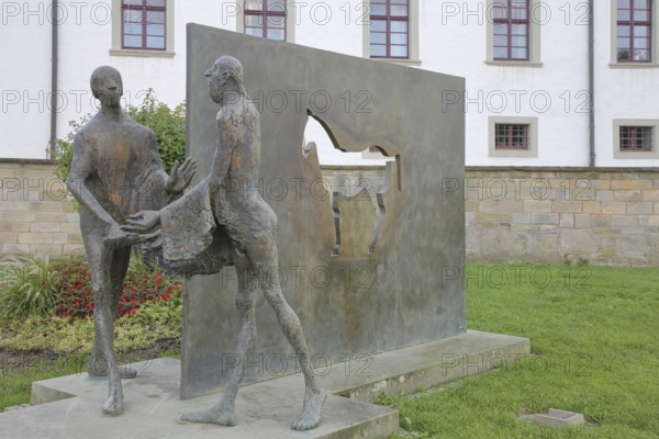 Sculpture Martin of Tours by Karl Ulrich Nuss, Saint Martin sharing his cloak with a beggar, symbol