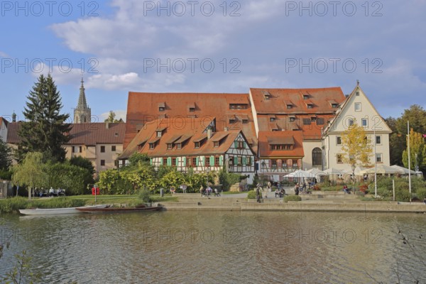 Half-timbered houses, town mill, tithe barn on the banks of the Neckar, pedestrians, boats,