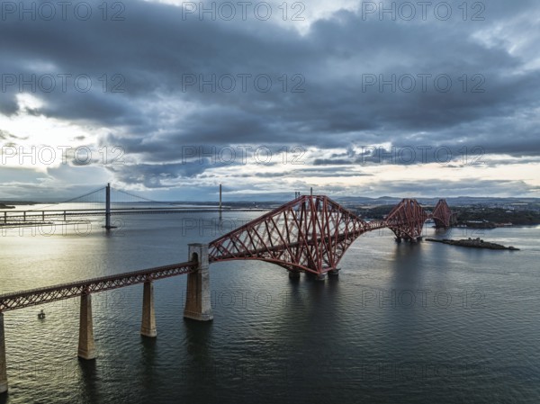 Rain clouds over Forth Bridge from a drone, Queensferry Crossing, Forth Estuary, Scotland, United